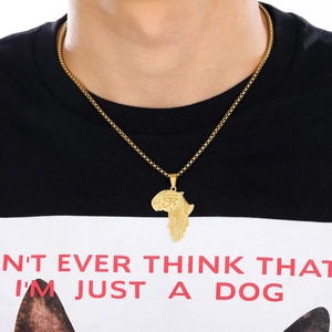 Detail of gold African map necklace pendant featuring the Eye of Horus on male model