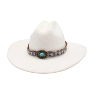 Detail of white wool cowboy hat featuring a woven ethnic band and turquoise stone ornament