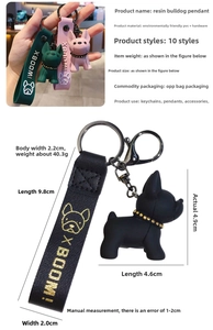 Detail showing French Bulldog keychain dimensions and resin texture with woven lanyard