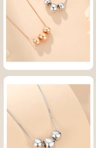 Close-up of gold and silver S925 necklaces featuring minimalist round bead pendants