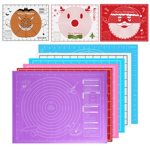 Thick silicone baking mat with festive designs and measurement scales for dough rolling