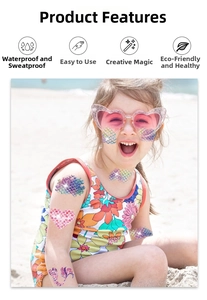 Detailed view of waterproof glitter mermaid scale temporary tattoos on child's skin at beach