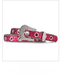 Detail of hot pink Y2K sequin belt with silver metal eyelets and rhinestone buckle