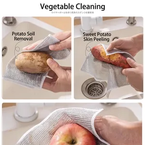 Multipurpose wire dishcloth cleaning potatoes and sweet potatoes in the kitchen