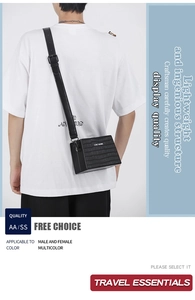 Black crocodile pattern box bag shown on model back highlighting its compact size