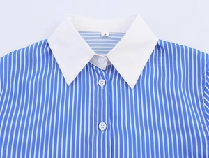 Detail of blue and white vertical striped shirt showing white collar and size S tag