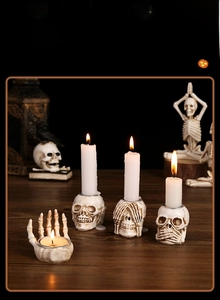 Macro detail of weathered resin skull candle holders with intricate carved textures