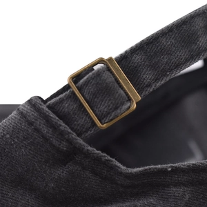 Macro detail of washed cotton baseball cap with adjustable vintage bronze metal buckle