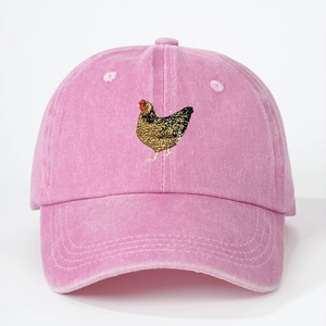 Pink washed cotton baseball cap featuring detailed hen embroidery and a curved brim