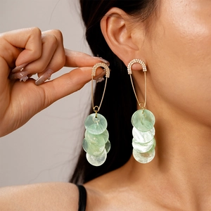 Fashion long gold pin earrings with sparkling rhinestones and green shell-like round charms