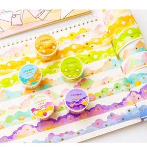 Close-up of Dream Cloud Washi Tape with wavy edges and cute animal patterns on a notebook