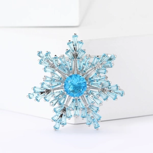 Elegant snowflake brooch with blue micro-paved zircons on a silver base for women