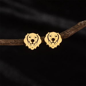 Golden stainless steel Labrador dog head stud earrings on a natural wood branch