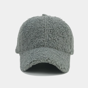 Close-up of the soft grey faux shearling texture on a winter baseball cap