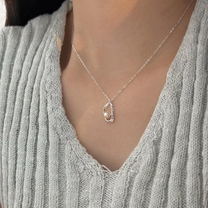 925 sterling silver necklace with irregular streamline pendant and white pearl detail
