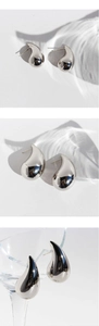 Detailed view of silver mirror polished teardrop earrings with elegant metal texture