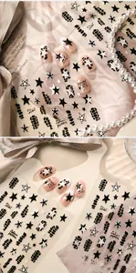 Macro detail of star pattern and rhythmic lines on street style nail stickers TS-4262
