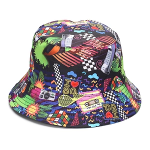 Close-up of 80s vintage pattern with cassette and I Love 80s print on black bucket hat