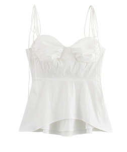 Detailed view of white camisole top featuring ruffled hem and pleated bust design