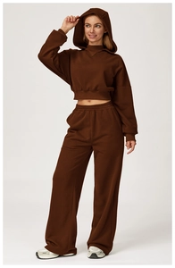 Detail of high-waist wide-leg sweatpants and crop hoodie in dark coffee knit fabric