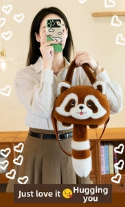 Detail of cute raccoon plush handbag with brown faux fur and a ring-textured long tail