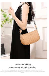 Close-up of khaki quilted leather crossbody bag with stylish lettered webbing strap