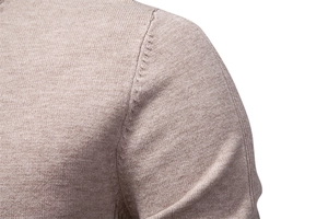 Macro view showing the shoulder seam and fine knit texture of this warm men's sweater