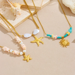 Three-layered gold stainless steel necklace with shell, starfish and sun charms
