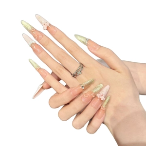 Sparkling pink French press-on nails with 3D gold flowers, pearls and bow accents