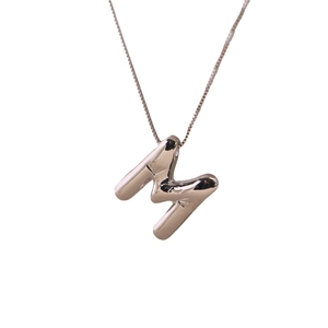 Minimalist silver letter M balloon style pendant necklace with smooth metallic finish