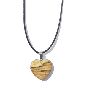 Macro view of 20mm heart-shaped stone pendant with natural brown textures on cord
