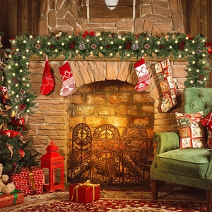 2.7m lighted Christmas garland with pine cones and red berries on a fireplace mantel