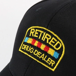 Black cotton baseball cap with Retired Drug Dealer embroidery patch in streetwear style