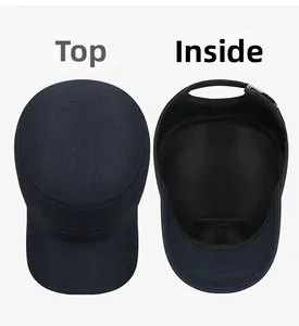 Detail view of the flat top and inner sweatband of a navy blue cotton military cap