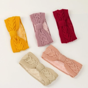 Detail of five assorted colors knitted ear-warmer headbands with soft fleece lining