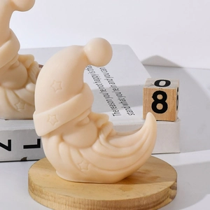 Christmas moon old man silicone candle mold with star relief detail on wooden base