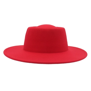 Detailed view of wide brim wool felt jazz hat with a flat top design in vibrant red