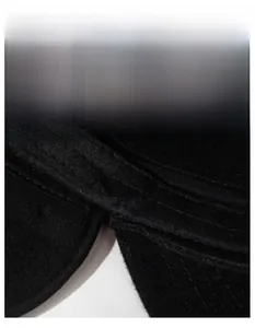 Macro view of wide sweatband design on winter flat cap with reinforced stitching