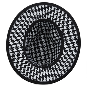 Classic houndstooth fedora hat with black trim in a top view perspective for autumn fashion