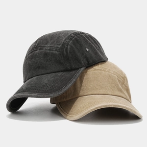 Vintage washed five-panel baseball caps in dark grey and khaki with metal eyelets