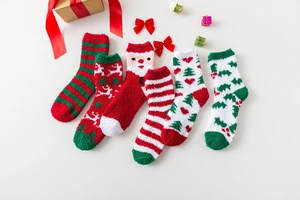 Festive Christmas coral fleece socks set with reindeer and Santa designs in gift setting