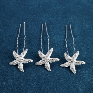 Detailed view of silver starfish hair pins with sparkling rhinestones set of three