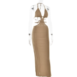 Detail of a brown knitted halter neck dress with waist cut-outs and intricate hollow pattern