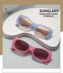 Detail of square polarized sunglasses in light blue and pink frames on white display