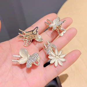 Mini golden metal butterfly and flower hair clips with cat eye stones and rhinestones