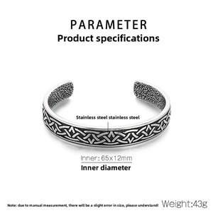 Detailed macro view of vintage Viking steel bracelet showing dimensions and inner texture