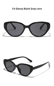 Detailed view of glossy black cat-eye sunglasses with gray lenses and a sleek modern design