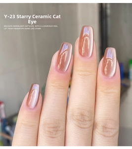 Macro shot of Y-23 star ceramic cat-eye gel polish with sparkling rose gold metallic shimmer