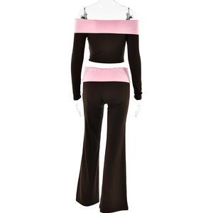 Rear view of slim fit off-shoulder crop top and flared trousers in black and pink