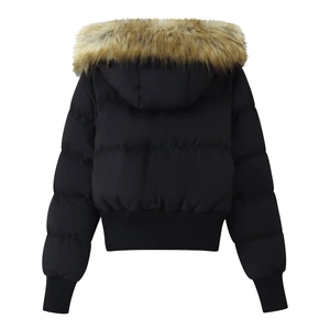 Detail of black puffer jacket showing a large brown faux fur hood and quilted pattern